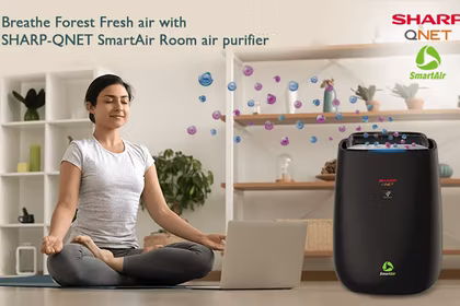 A young woman doing Yoga in front of SHARP Smart Air