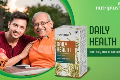 Young Indian adult son embracing father and sitting outdoors in lawn with Nutriplus DailyHealth in the frame.