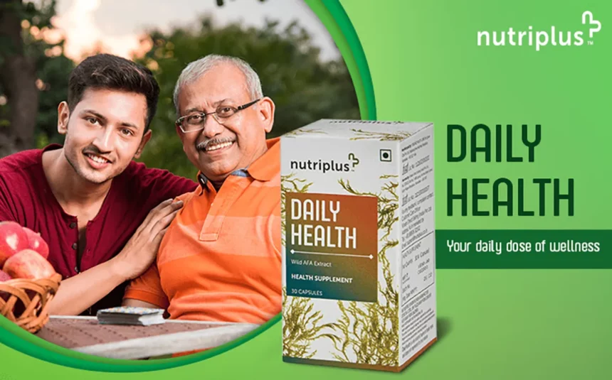 Young Indian adult son embracing father and sitting outdoors in lawn with Nutriplus DailyHealth in the frame.