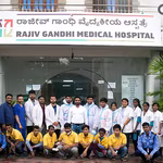 Doctors and staff standing outside Rajiv Gandhi Medical Hospital as a part of Project CoHeal by QNET India.