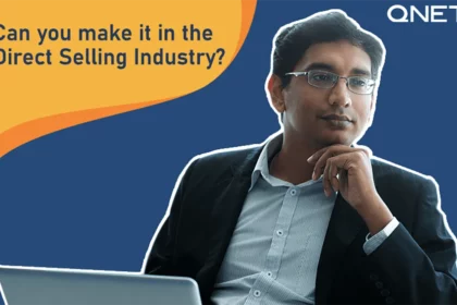 Featured Image A middle aged entrepreneur sitting in front of a laptop thinking about the direct selling industry.