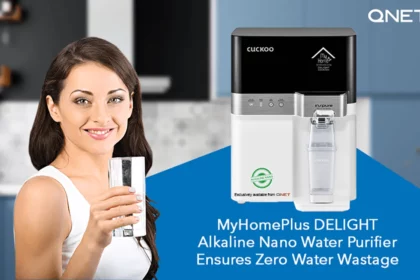 A young woman drinking water in her kitchen with MyHomePlus DELIGHT – Alkaline Nano Water Purifier in the frame