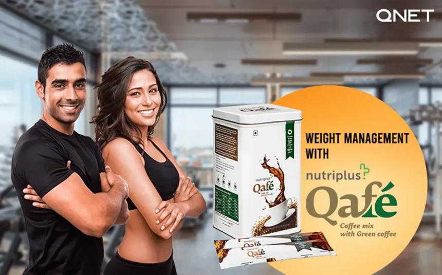 A fit Indian couple standing in a gym folding arms with Nutriplus Qafe in the frame