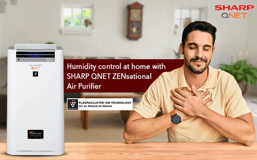 Happy Indian man breathing fresh air at home with SHARP QNET ZENsational air purifier in the frame