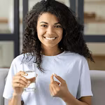 A young lady consuming Nutriplus-health supplements