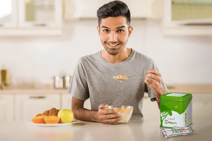 A young man eating healthy food with Fibre Fit