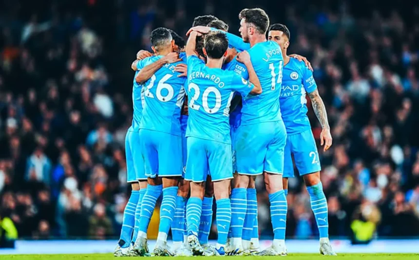 Manchester-City players celebrate after scoring a goal