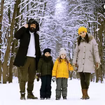 A family standing in snow