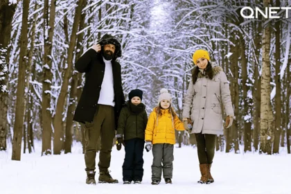 A family standing in snow