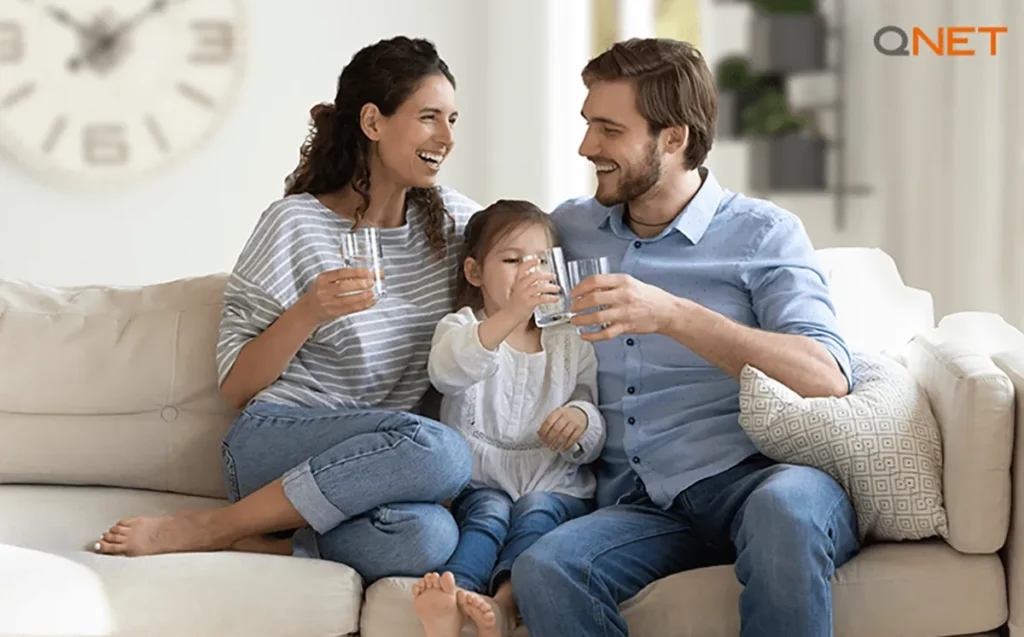 A family drinking pure water from MyHomePlus alkaline water purifiers on World Water Day
