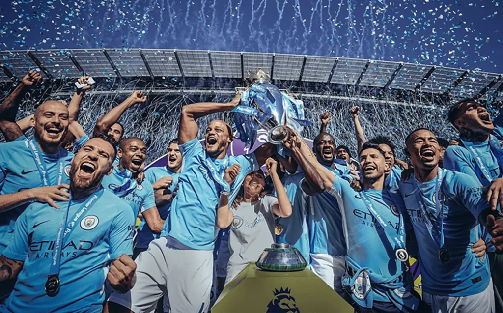 Manchester City players lift the Premier League title in 2017-18