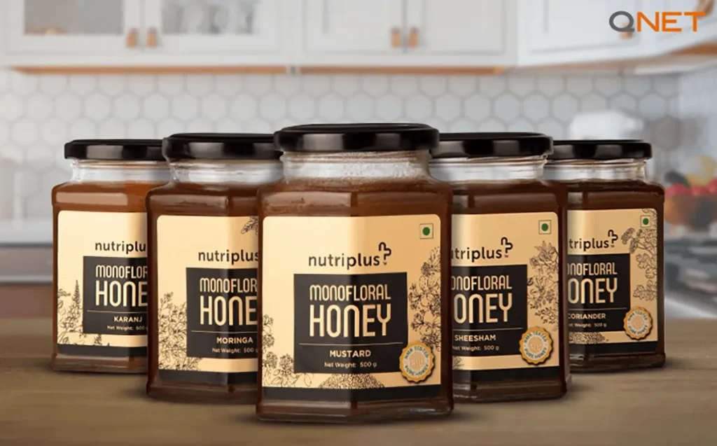 Featuring the 5 variants of Nutriplus Monofloral Honey by QNET India with an NMR-tested logo