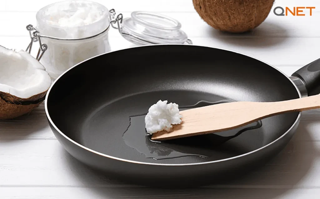 Nutriplus Virgin Coconut Oil on a frying pan while cooking