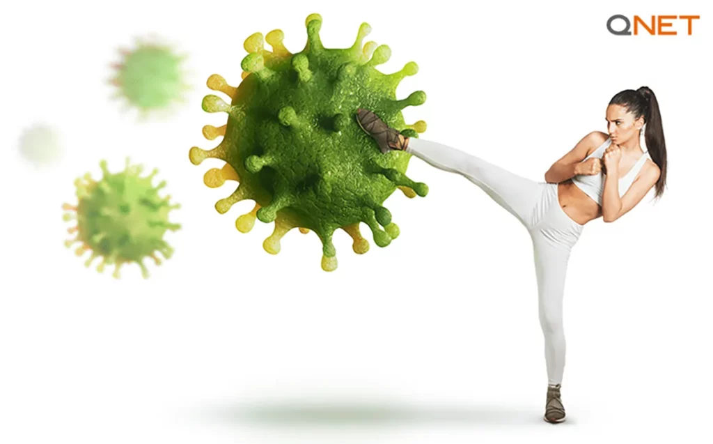 A young woman fighting a harmful virus depicting a healthy immune system