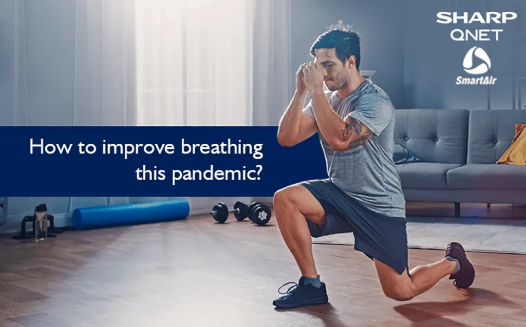 An athletic man exercising at home with how to improve breathing during this pandemic in the frame