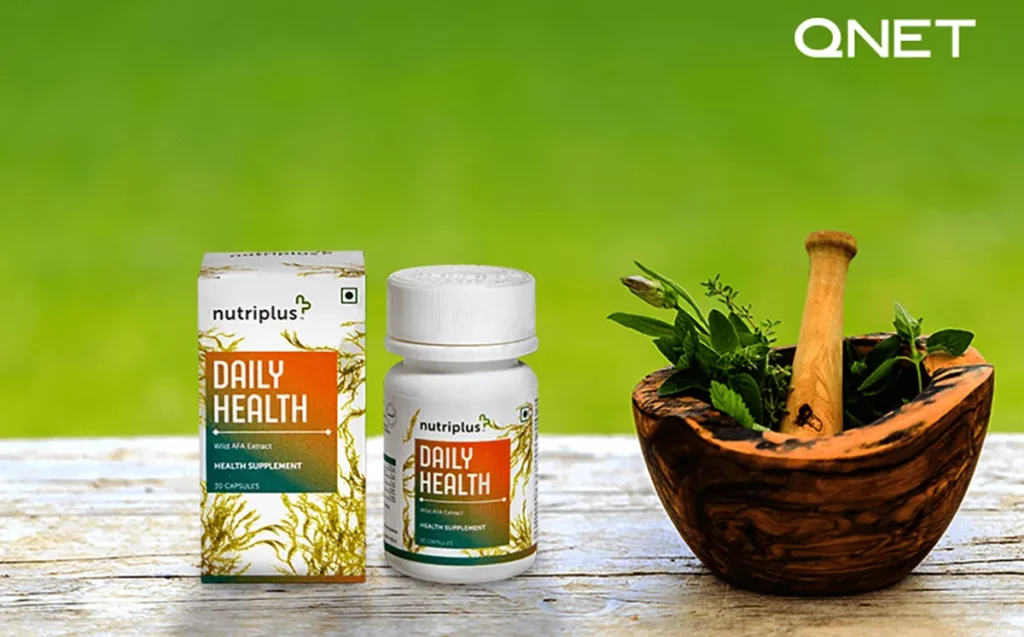 Fresh herbs in a mortar with Nutriplus DailyHealth on the table.