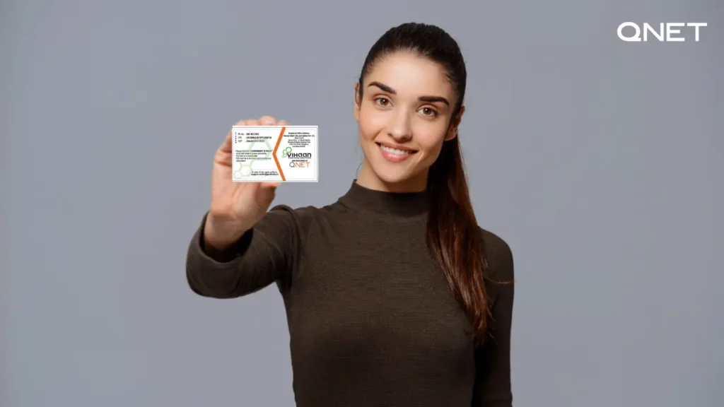 A QNET Distributor Showing her ID card