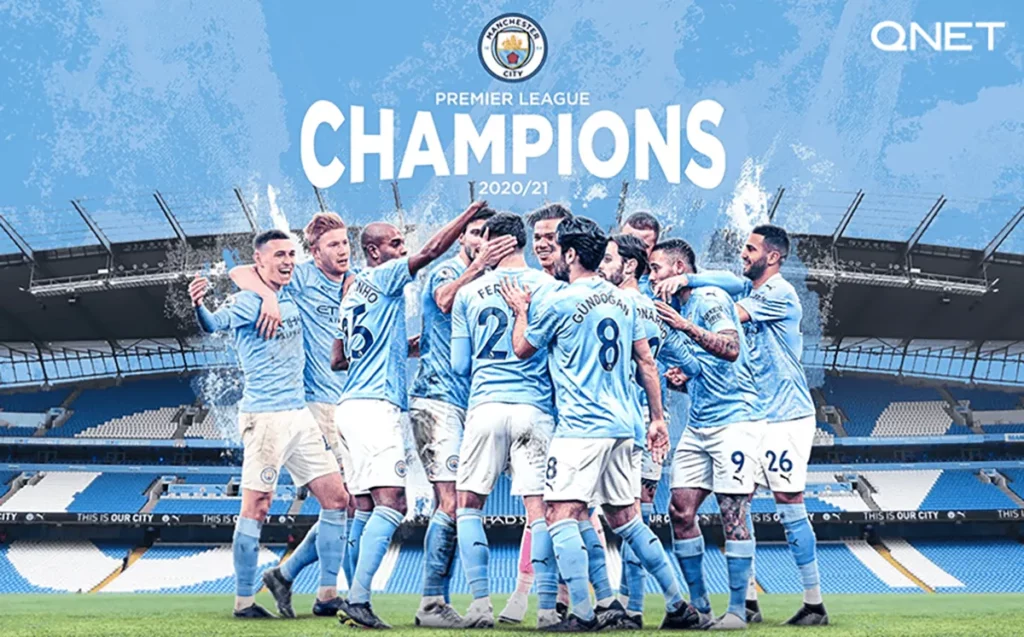 Manchester City players celebrate becoming the Premier League Champions at the Etihad Stadium