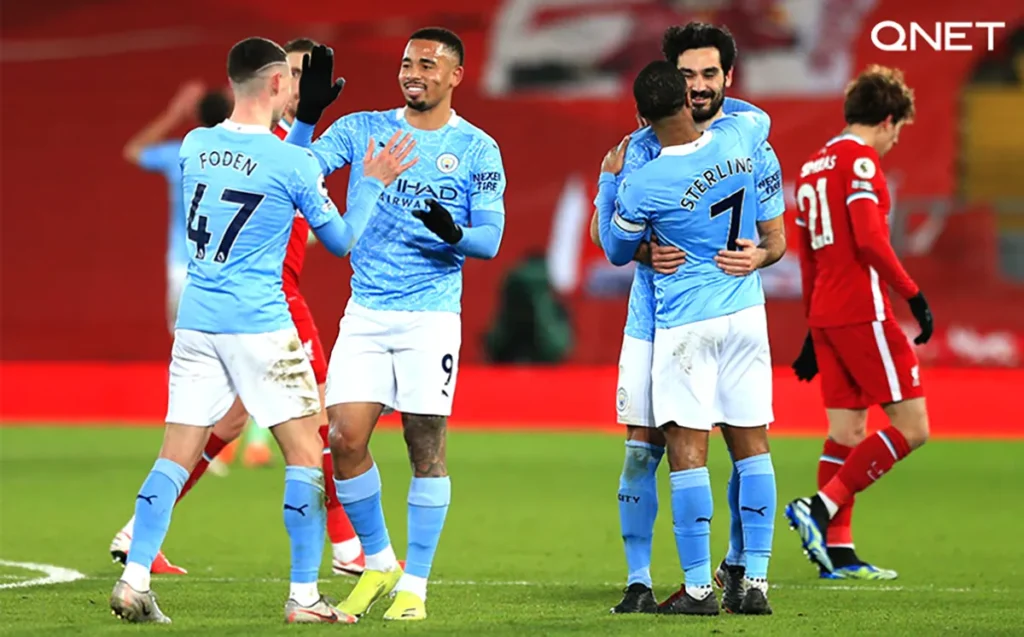 Manchester City players celebrating the goal against Liverpool