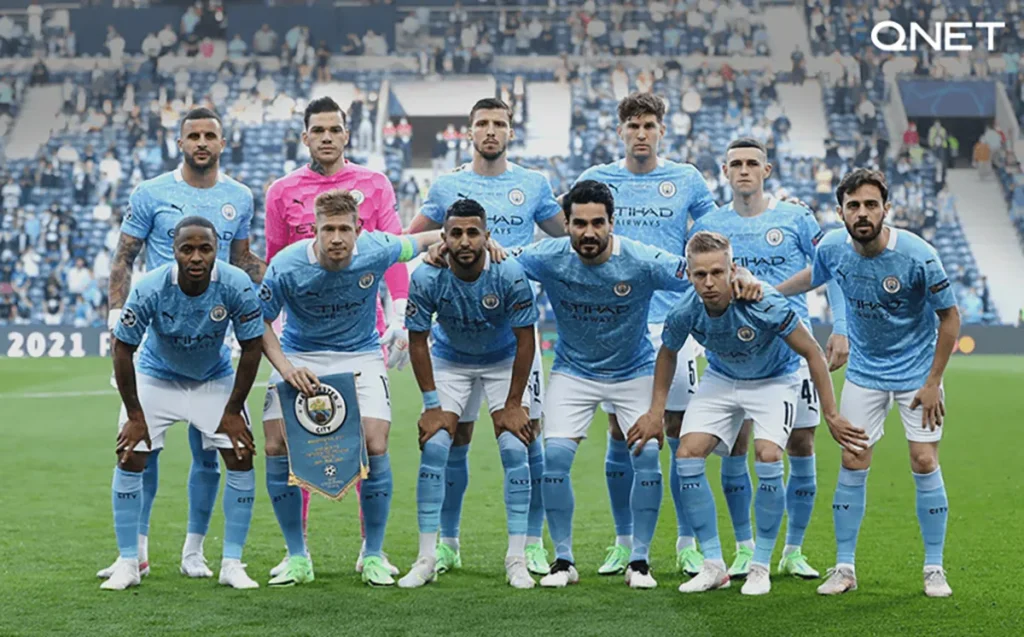 Manchester City players posing for a picture before a game