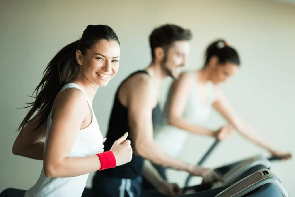 Smiling woman on a treadmill 