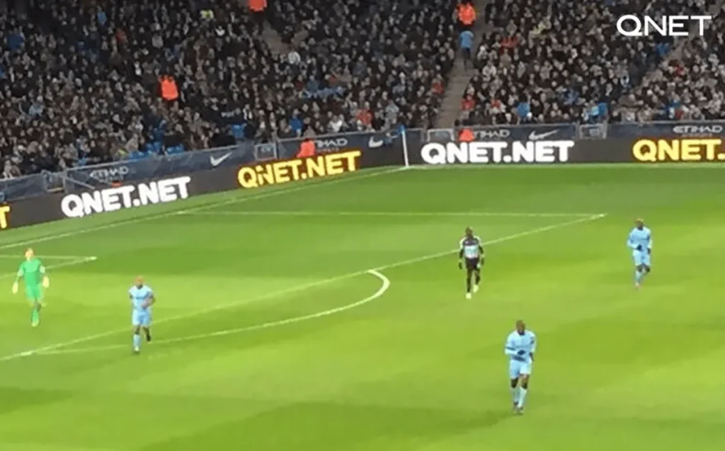 QNET logo displayed on LED boards in the Etihad stadium