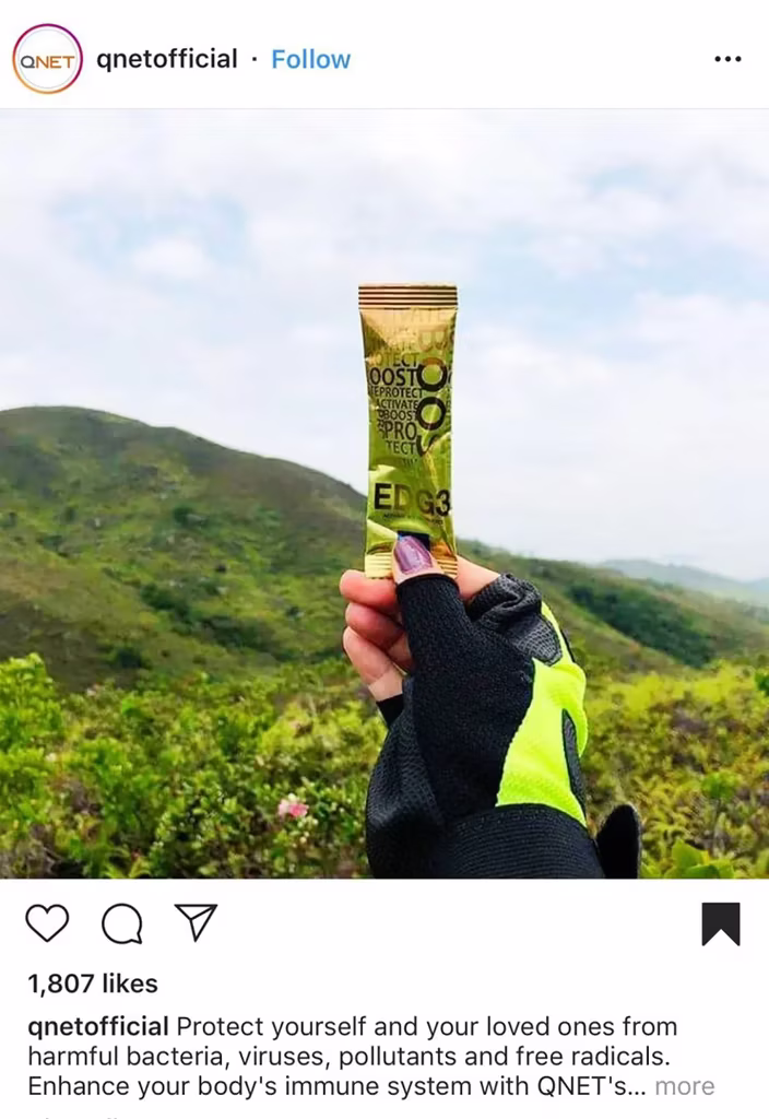 World Photography Day: A hand holding a sachet of EDG3 against the natural background