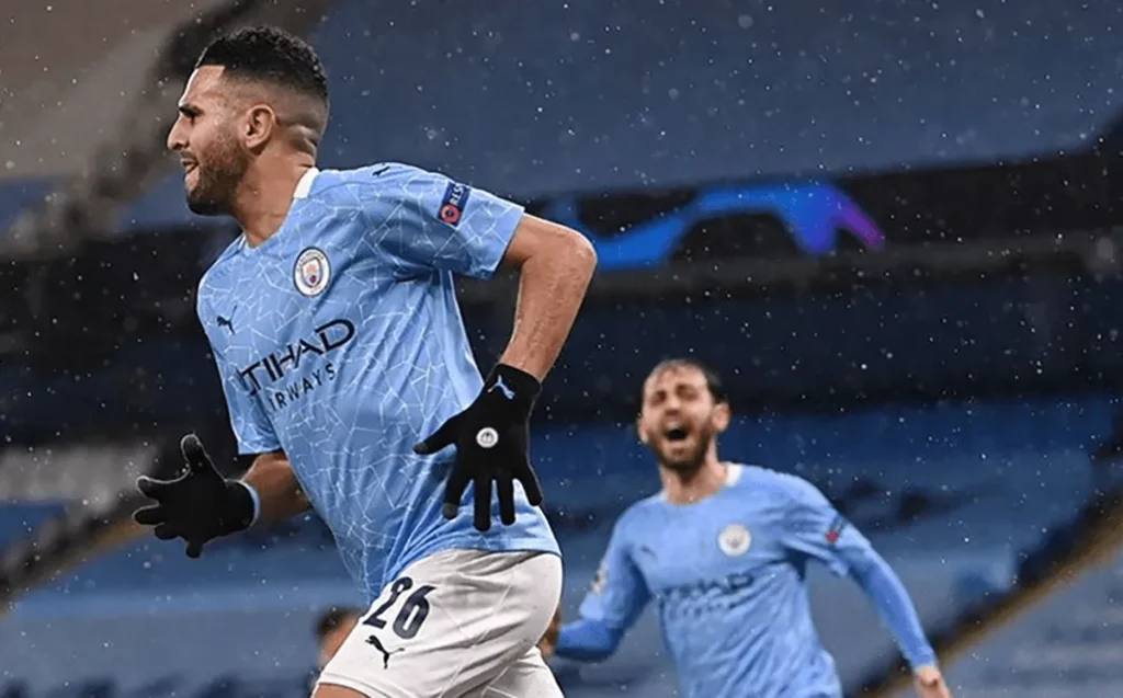 Riyadh Mahrez of Manchester City celebrates after scoring a goal in the Champions League.