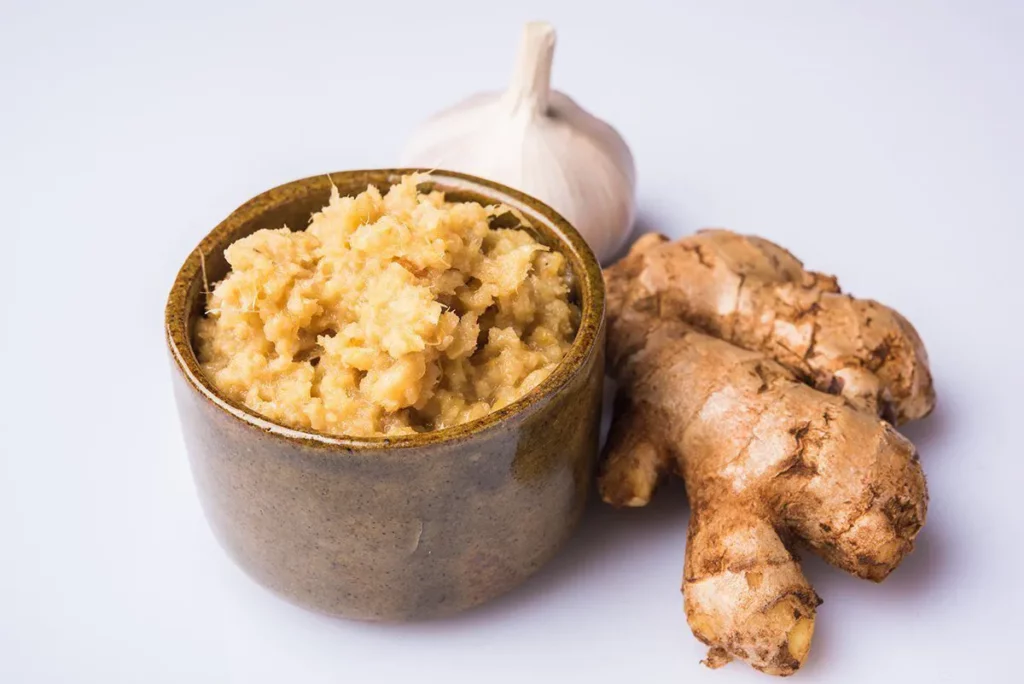 Immunity-boosting foods: a cup of ginger paste with a clove of garlic 