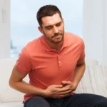 A Man suffering from gastric problems
