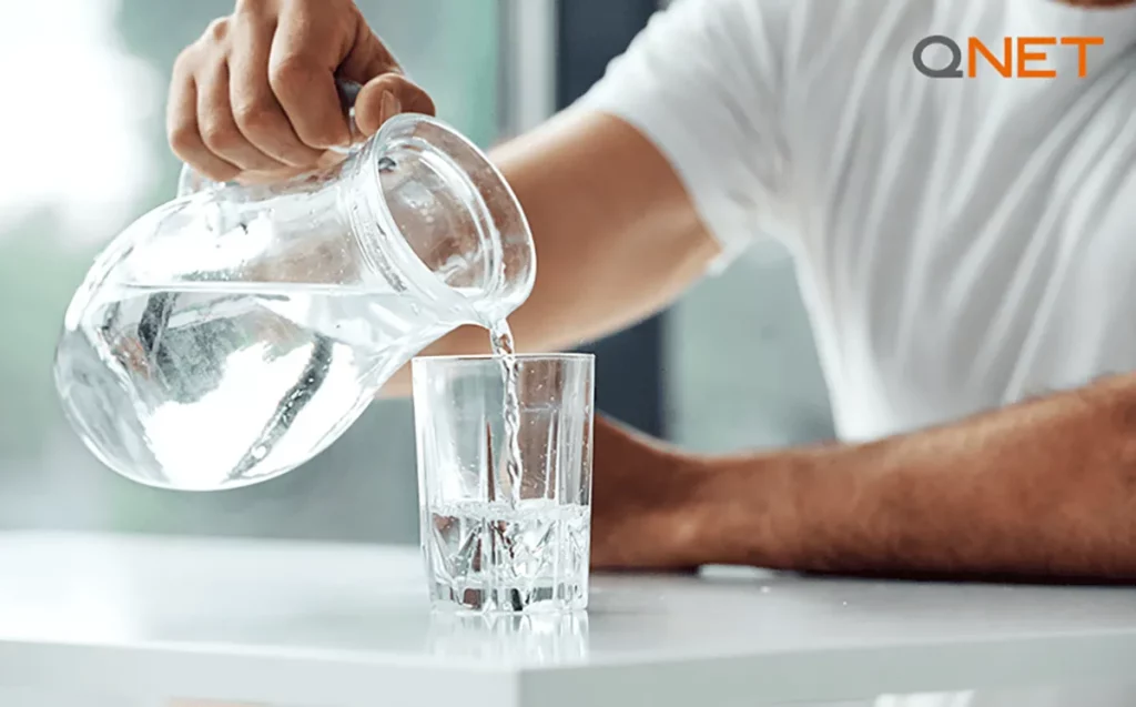 A man drinking water to prevent dehydration