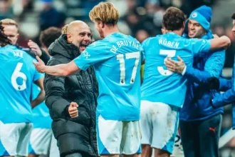 Pep Guardiola celebrates with Kevin De Bruyne after Manchester City wins