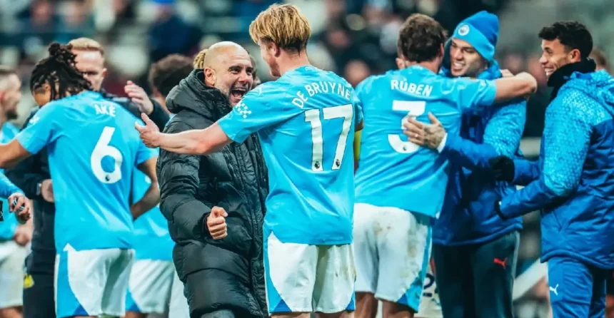 Pep Guardiola celebrates with Kevin De Bruyne after Manchester City wins