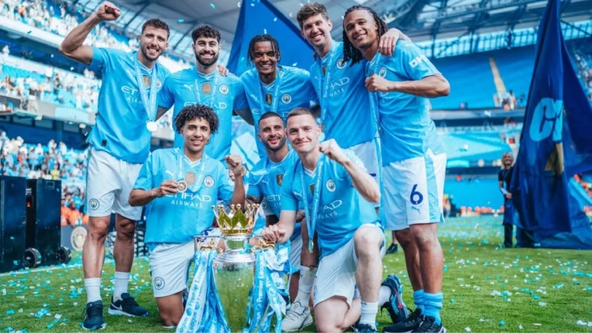 Manchester City players celebrate their historic fourth consecutive Premier League title win on the pitch